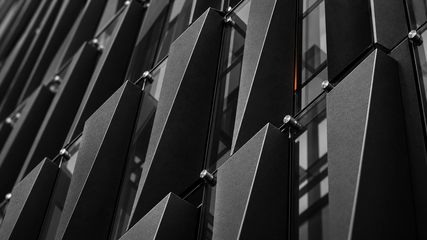 Angled facade fins in charcoal and steel